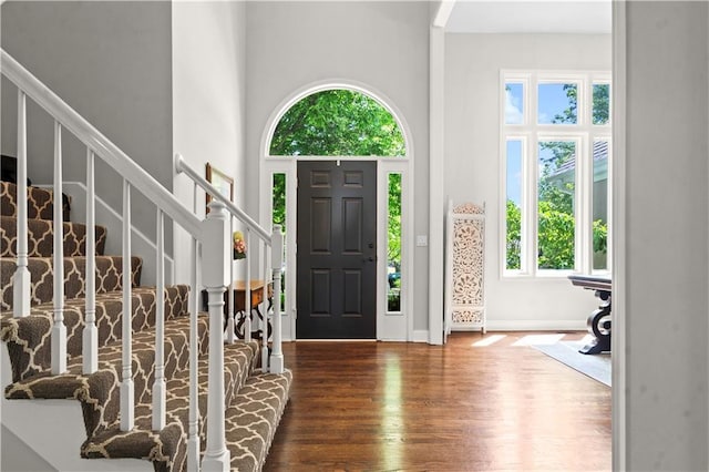 5510 W 153rd Ter, Overland Park, KS 66223 - entrance foyer with healthy amount of natural light, wood finished floors, stairs, and a high ceiling