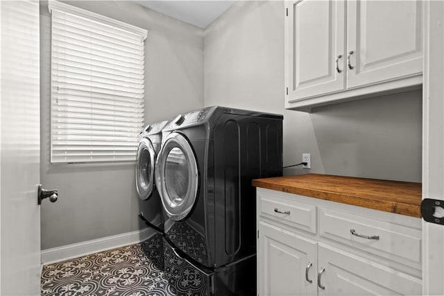 5510 W 153rd Ter, Overland Park, KS 66223 - laundry area featuring washing machine and clothes dryer, baseboards, tile patterned flooring, and cabinet space