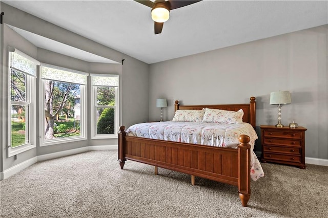 5510 W 153rd Ter, Overland Park, KS 66223 - carpeted bedroom featuring baseboards, multiple windows, and a ceiling fan
