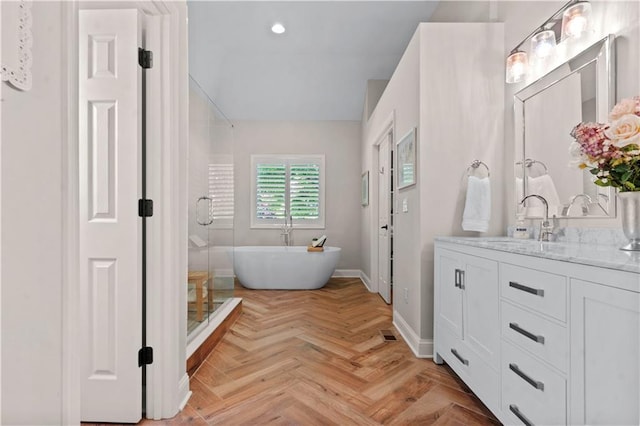 5510 W 153rd Ter, Overland Park, KS 66223 - full bathroom with vanity, a freestanding bath, recessed lighting, baseboards, and a shower
