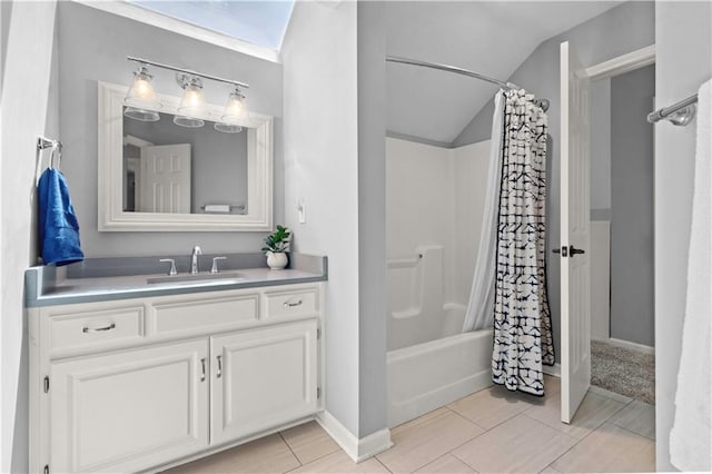 5510 W 153rd Ter, Overland Park, KS 66223 - bathroom with lofted ceiling, vanity, shower / bath combo, and baseboards