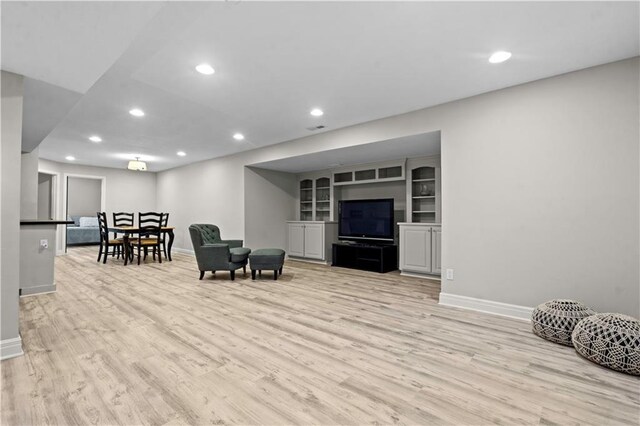 5510 W 153rd Ter, Overland Park, KS 66223 - living room with baseboards, wood finished floors, and recessed lighting