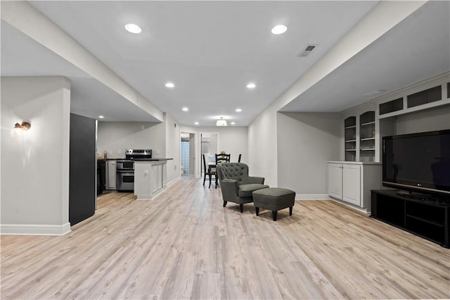 5510 W 153rd Ter, Overland Park, KS 66223 - living area with baseboards, light wood finished floors, and recessed lighting