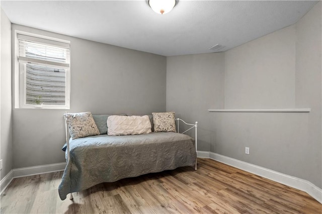 5510 W 153rd Ter, Overland Park, KS 66223 - bedroom with light wood-style flooring and baseboards