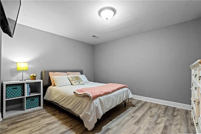 5510 W 153rd Ter, Overland Park, KS 66223 - bedroom with wood finished floors and baseboards