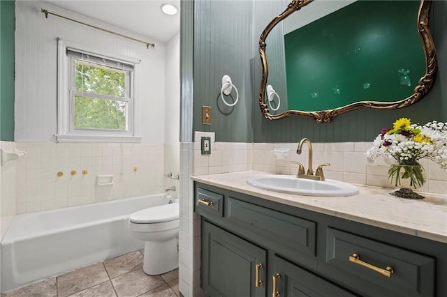 bathroom with toilet, tile patterned floors, a tub to relax in, and vanity
