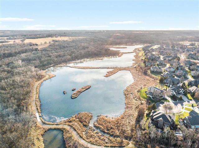 birds eye view of property with a water view and a residential view