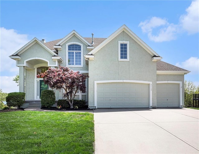 view of front facade with a garage, a front lawn, roof with shingles, stucco siding, and driveway