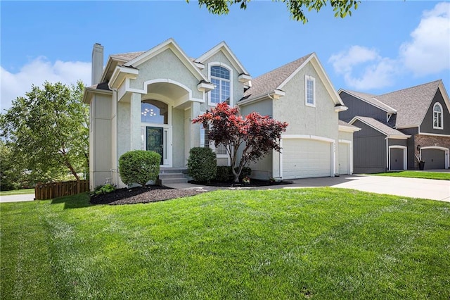 traditional home featuring a chimney, an attached garage, driveway, and a front yard