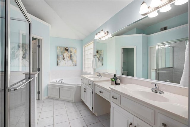bathroom featuring a sink, tile patterned floors, lofted ceiling, visible vents, and a bath
