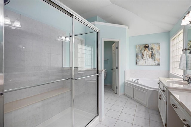 bathroom featuring a garden tub, tile patterned flooring, vaulted ceiling, a shower stall, and vanity