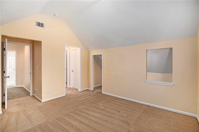 bonus room featuring carpet floors, baseboards, lofted ceiling, and visible vents