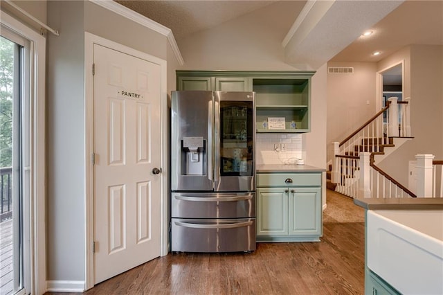 18716 W 164th Ter, Olathe, KS 66062 - kitchen featuring stainless steel fridge, green cabinetry, wood finished floors, backsplash, and lofted ceiling