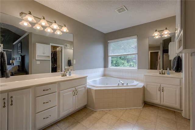 18716 W 164th Ter, Olathe, KS 66062 - full bathroom with double vanity, a garden tub, and a textured ceiling