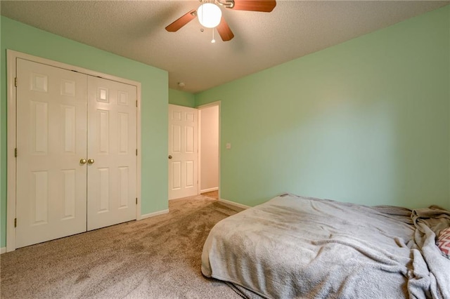 18716 W 164th Ter, Olathe, KS 66062 - bedroom with carpet flooring, baseboards, ceiling fan, a closet, and a textured ceiling