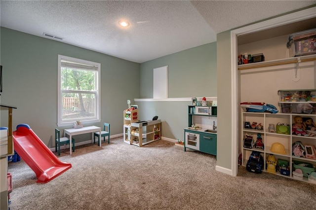 18716 W 164th Ter, Olathe, KS 66062 - rec room with carpet, a textured ceiling, and baseboards