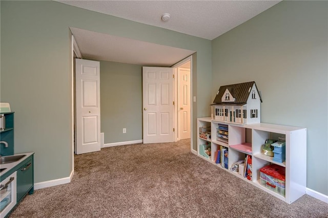 18716 W 164th Ter, Olathe, KS 66062 - recreation room featuring carpet floors, a sink, baseboards, and a textured ceiling