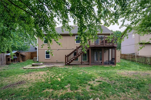 18716 W 164th Ter, Olathe, KS 66062 - back of house with stairway, a fire pit, a wooden deck, french doors, and roof with shingles