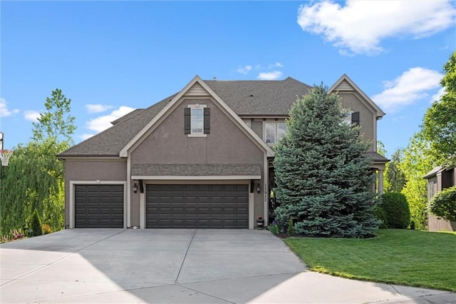 view of front of home with stucco siding, concrete driveway, a front lawn, a garage, and roof with shingles