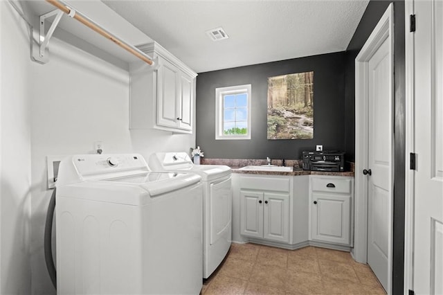 laundry area featuring cabinet space and washer and clothes dryer