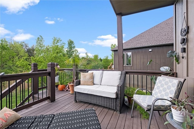 wooden terrace featuring outdoor lounge area