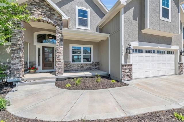 12765 N Imperial Dr, Platte City, MO 64079 - doorway to property featuring stone siding, a porch, a garage, and stucco siding
