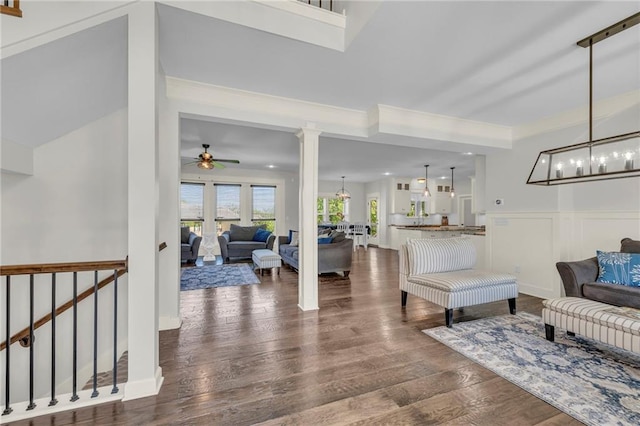 12765 N Imperial Dr, Platte City, MO 64079 - living room featuring a ceiling fan, wood finished floors, wainscoting, a chandelier, and recessed lighting