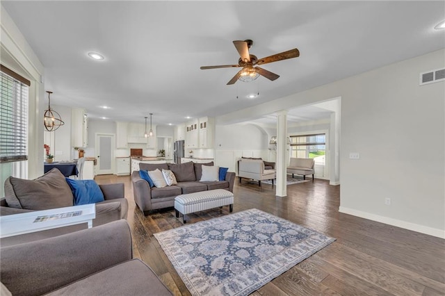 12765 N Imperial Dr, Platte City, MO 64079 - living area with decorative columns, a ceiling fan, baseboards, dark wood finished floors, and recessed lighting