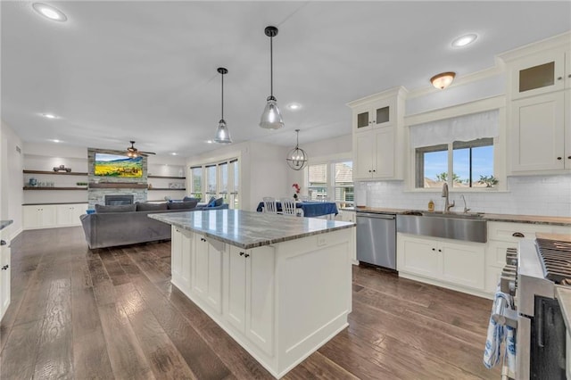 12765 N Imperial Dr, Platte City, MO 64079 - kitchen featuring a sink, appliances with stainless steel finishes, a center island, recessed lighting, and decorative backsplash