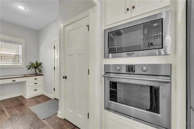 12765 N Imperial Dr, Platte City, MO 64079 - kitchen featuring appliances with stainless steel finishes, dark wood-type flooring, white cabinetry, baseboards, and recessed lighting