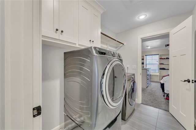 12765 N Imperial Dr, Platte City, MO 64079 - washroom featuring cabinet space, washing machine and clothes dryer, light colored carpet, light tile patterned floors, and recessed lighting