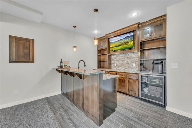 12765 N Imperial Dr, Platte City, MO 64079 - bar with beverage cooler, baseboards, light wood-style floors, decorative light fixtures, and recessed lighting