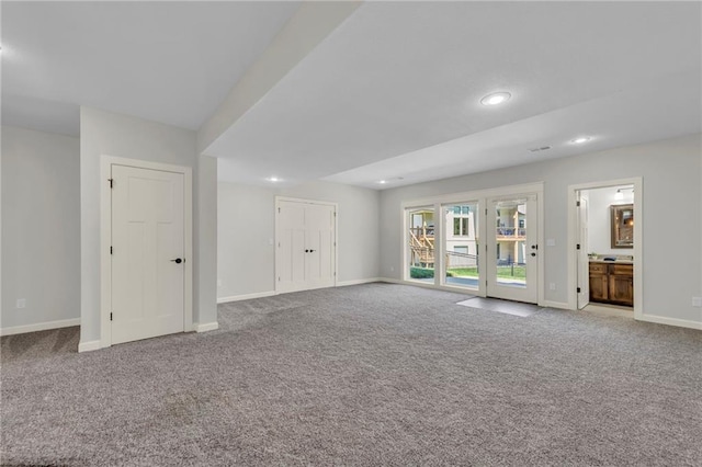 12765 N Imperial Dr, Platte City, MO 64079 - unfurnished living room with carpet floors, baseboards, and recessed lighting