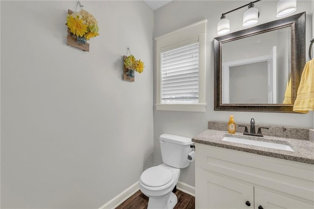 12765 N Imperial Dr, Platte City, MO 64079 - bathroom with wood finished floors, toilet, baseboards, and vanity