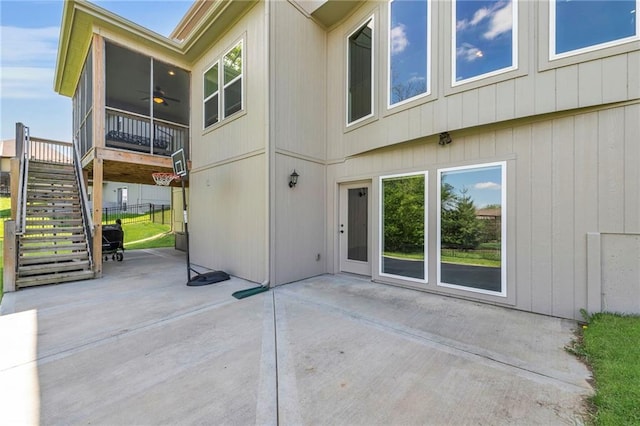 12765 N Imperial Dr, Platte City, MO 64079 - back of house featuring ceiling fan, a patio, a sunroom, and stairs