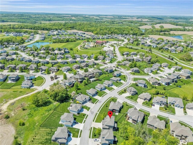 12765 N Imperial Dr, Platte City, MO 64079 - aerial view of property and surrounding area featuring a nearby body of water and nearby suburban area