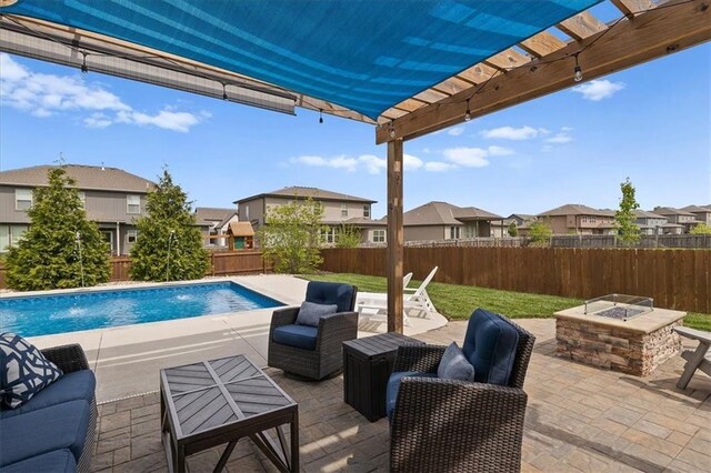 view of swimming pool with a fire pit, a residential view, a pergola, and a patio