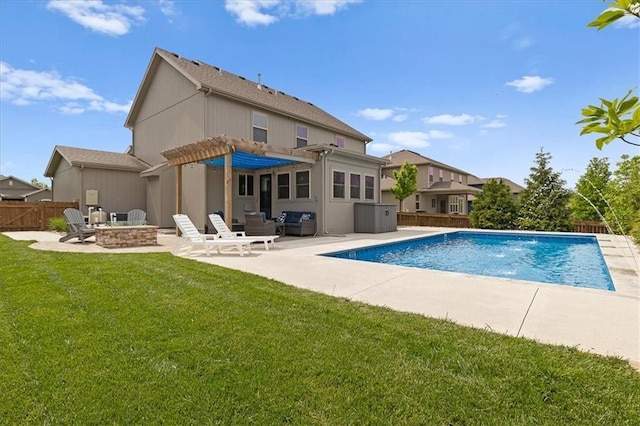 rear view of house featuring an outdoor fire pit and a patio