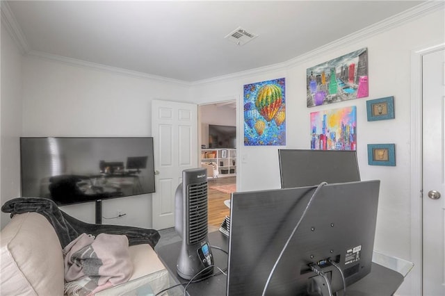 office space with visible vents and ornamental molding