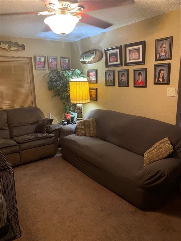 living room featuring a textured ceiling, a ceiling fan, and carpet floors