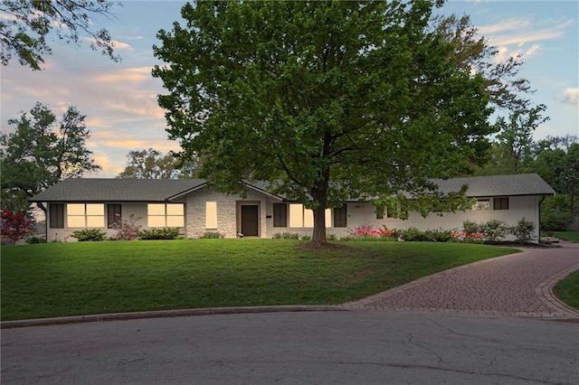 9818 Overbrook Ct, Leawood, KS 66206 - view of front of house with a yard and driveway