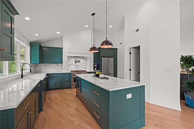 9818 Overbrook Ct, Leawood, KS 66206 - kitchen with green cabinetry, a sink, a center island, decorative backsplash, and premium appliances
