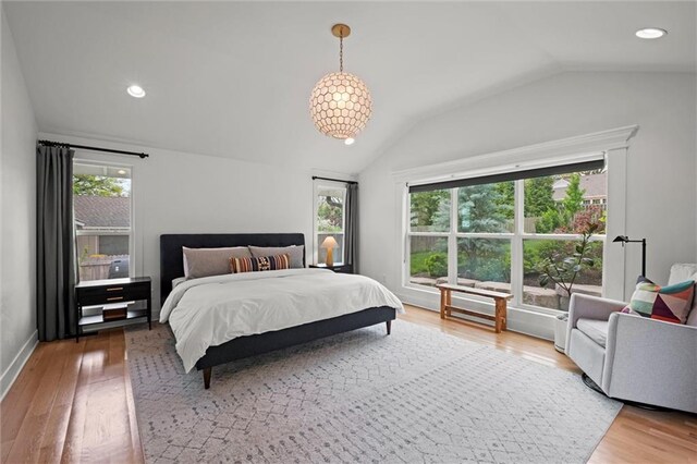 9818 Overbrook Ct, Leawood, KS 66206 - bedroom with multiple windows, recessed lighting, wood finished floors, and lofted ceiling