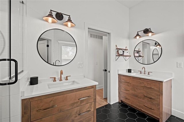 9818 Overbrook Ct, Leawood, KS 66206 - full bathroom featuring visible vents, a sink, two vanities, and tile patterned flooring