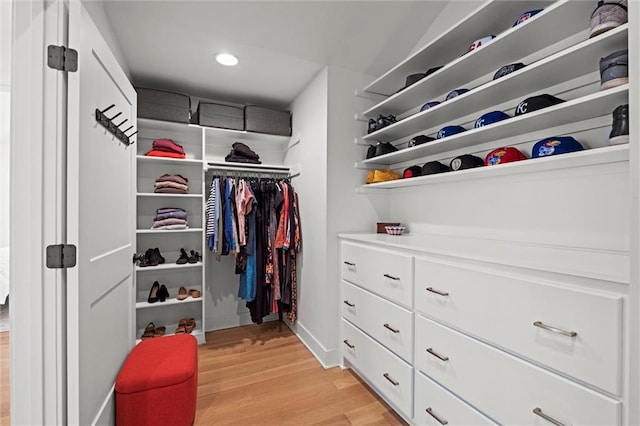 9818 Overbrook Ct, Leawood, KS 66206 - walk in closet featuring light wood-type flooring