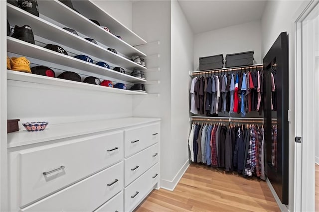 9818 Overbrook Ct, Leawood, KS 66206 - walk in closet featuring light wood-style flooring