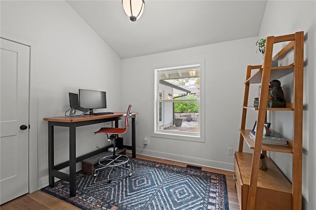 9818 Overbrook Ct, Leawood, KS 66206 - office area featuring baseboards, visible vents, wood finished floors, and lofted ceiling