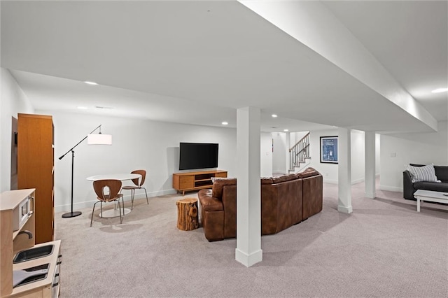 9818 Overbrook Ct, Leawood, KS 66206 - living room featuring light colored carpet, recessed lighting, stairs, and baseboards