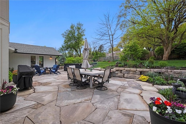 9818 Overbrook Ct, Leawood, KS 66206 - view of patio with grilling area, french doors, outdoor dining space, and a fenced backyard