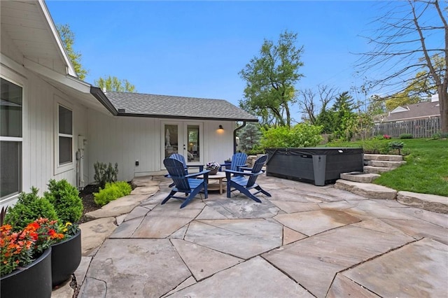 9818 Overbrook Ct, Leawood, KS 66206 - view of patio / terrace with fence, a hot tub, and french doors